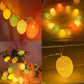 Colorful battery-powered egg light string with glowing cotton-thread bulbs in mixed colors