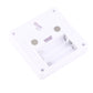 Underside of square white night light lamp with battery contacts and spring hardware