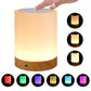Touch charging night light, hand on top; warm yellow glow over white cylinder