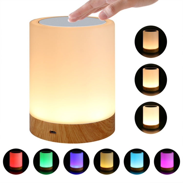 Touch charging night light, hand on top; warm yellow glow over white cylinder