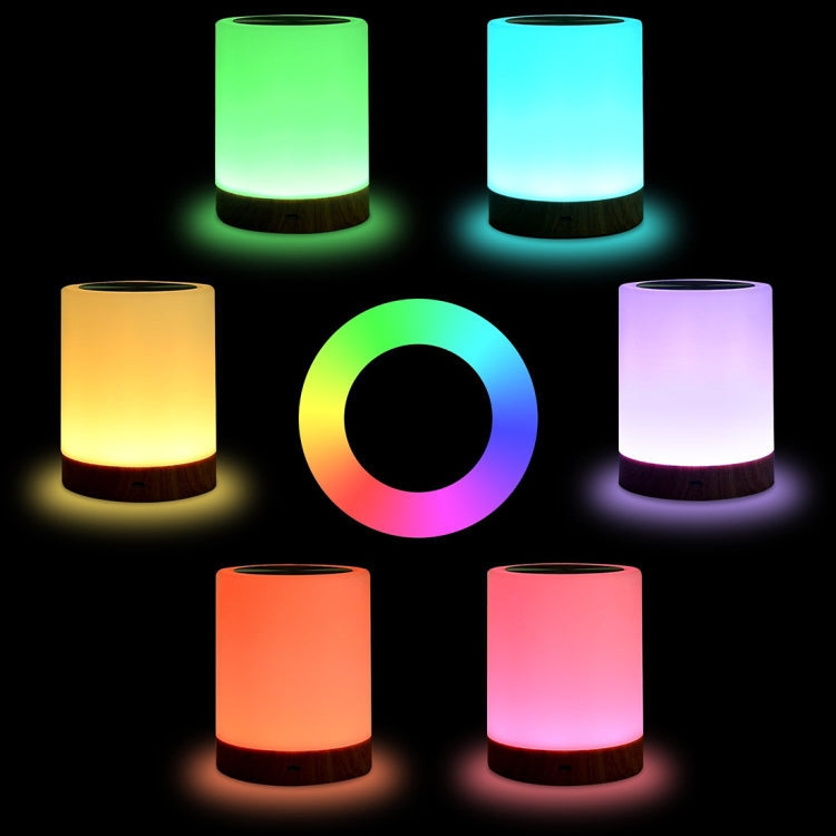 Color-changing charging night light with glowing LED cylinder and wood base