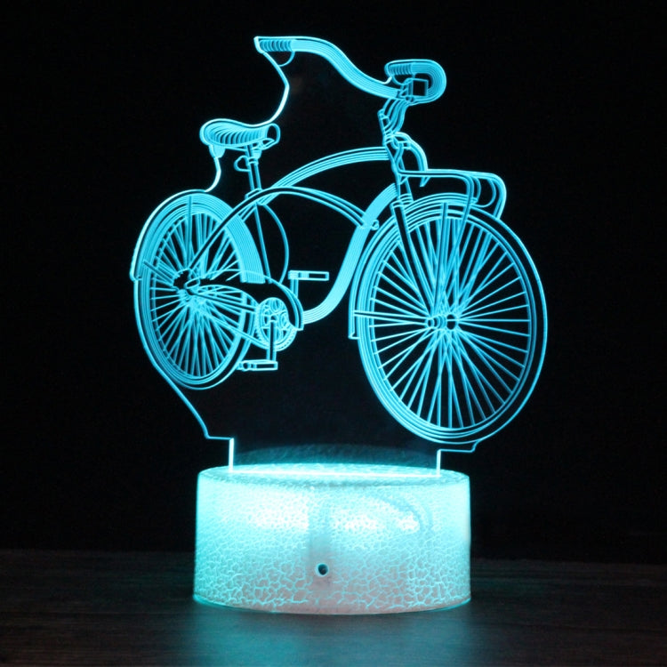 Glowing 3D LED bicycle night light with teal outline and frosted white base