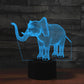 Elephant-shaped 3D LED table lamp with blue wireframe glow in a clear display