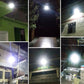 Solar LED flood lights with bright illumination on exterior steps, walls, and yard