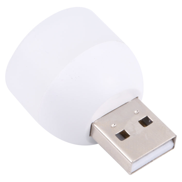Mini USB night light with white lamp head and silver USB plug, close-up view.