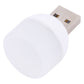 White mini USB night light with silver USB plug, angled close-up.
