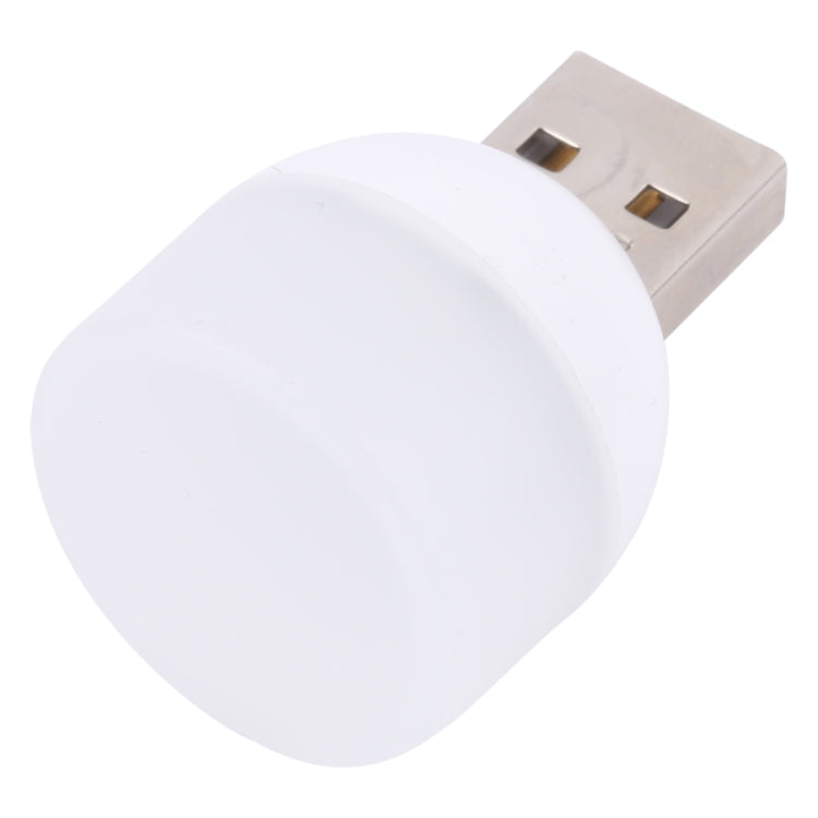 White mini USB night light with silver USB plug, angled close-up.