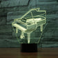 Piano-shaped 3D LED table lamp, glowing outline in a clear cube on a black stand