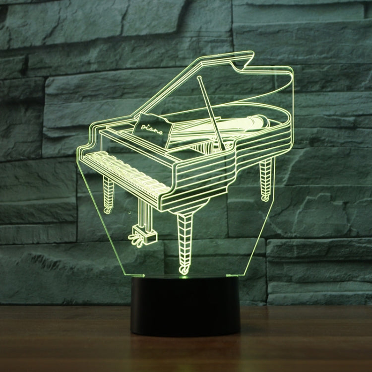 Piano-shaped 3D LED table lamp, glowing outline in a clear cube on a black stand