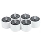 Group of white LED candle night lights with clear flame caps on dark round solar panels