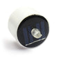 White cylindrical LED night light with dark solar panel and clear flame LED top