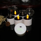 Lit white LED candle night lights with glowing flame effect and clear top LEDs