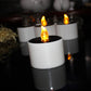 Front view of lit white LED candle night light with glowing flame effect topper