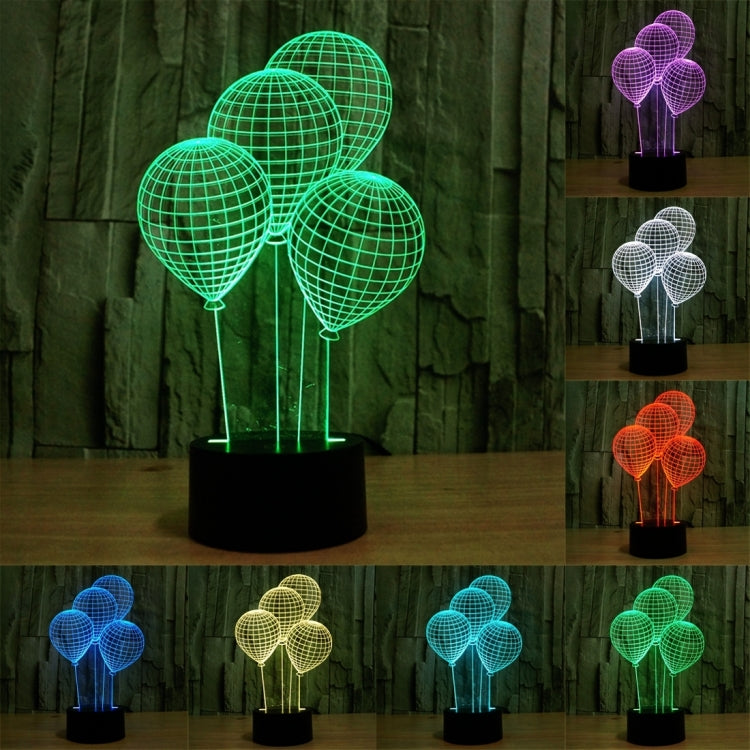 Balloon-style globe LED desk lamp with four lit wire spheres on black base