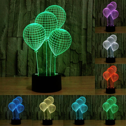 Balloon-style globe LED desk lamp with four lit wire spheres on black base