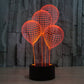Balloon-style globe desk lamp with orange wire spheres and black cylindrical base