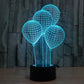 Balloon-style globe LED desk lamp with turquoise lit wire spheres on black base