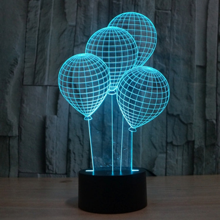 Balloon-style globe LED desk lamp with turquoise lit wire spheres on black base