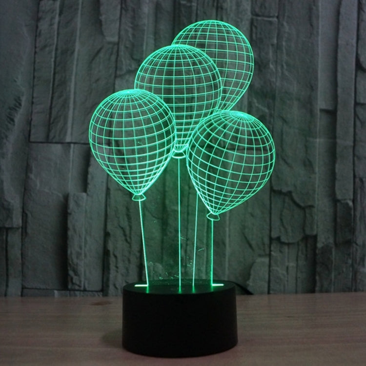 Balloon-style globe LED desk lamp with green lit wire spheres on black base