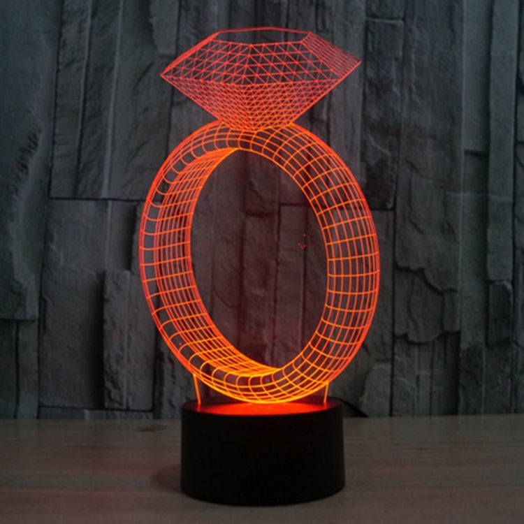 Diamond-ring LED desk lamp glowing red with diamond top and oval ring