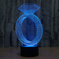 Diamond-ring LED desk lamp glowing blue with diamond top and oval ring