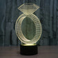 Diamond-ring LED desk lamp glowing gold with diamond top and oval ring