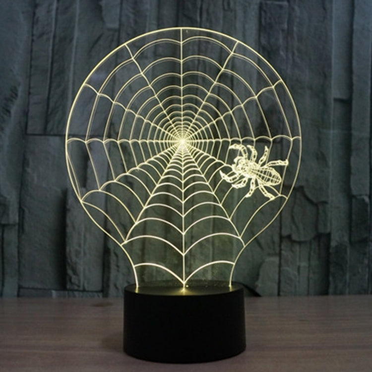 Cobweb-style desk night light with gold glowing spiderweb globe and winged figure