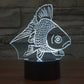 Goldfish-style desk lamp with glowing white fish silhouette and black base