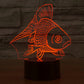 Goldfish-style 3D desk night light glowing red fish on a black cylinder base