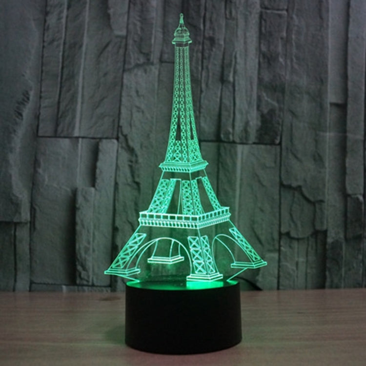 Eiffel Tower desk night light with green glowing tower and black round base