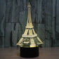 Eiffel Tower LED desk lamp glowing warm white/yellow on black base