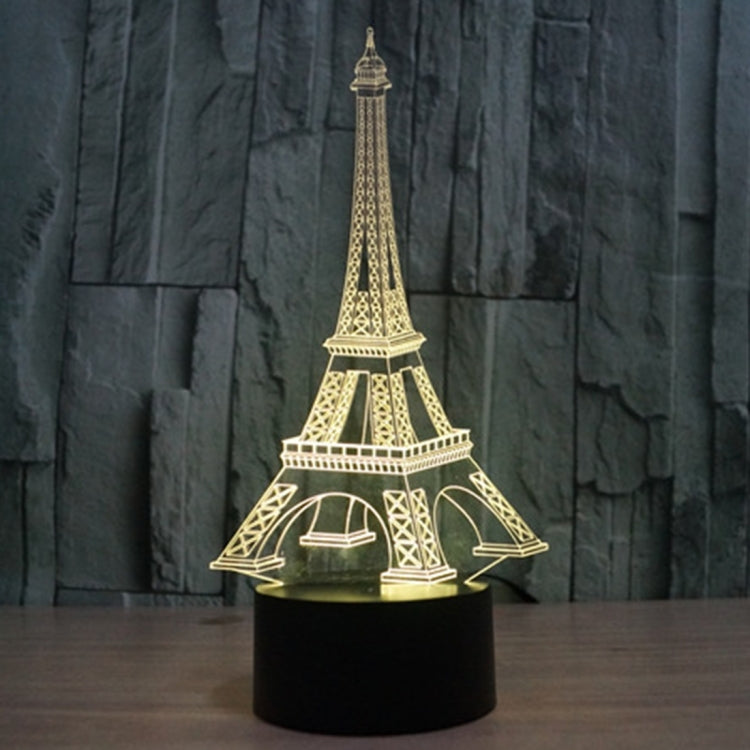 Eiffel Tower LED desk lamp glowing warm white/yellow on black base