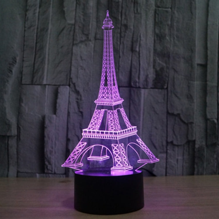 Eiffel Tower LED desk lamp glowing purple on black base
