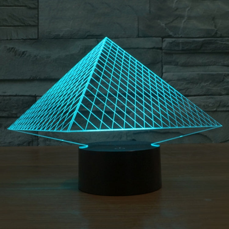 Pyramid wireframe desk lamp with cyan glow, triangular shade on black base