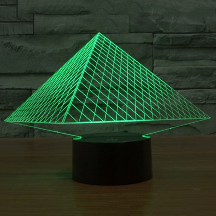 Pyramid LED desk lamp with glowing green triangular grid over black base