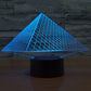 Pyramid LED desk lamp with glowing blue triangular grid over black base