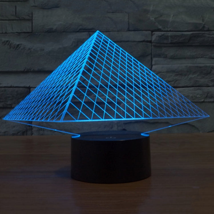 Pyramid LED desk lamp with glowing blue triangular grid over black base