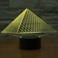 Pyramid LED desk lamp with glowing yellow triangular grid over black base