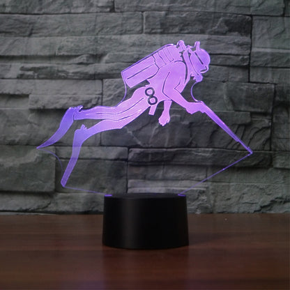 Purple 3D LED diver night light on black cylindrical base