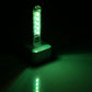 Small green LED night light with 5 glowing bulbs on a white base