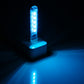 USB LED night light glowing blue with 5 LEDs through clear casing