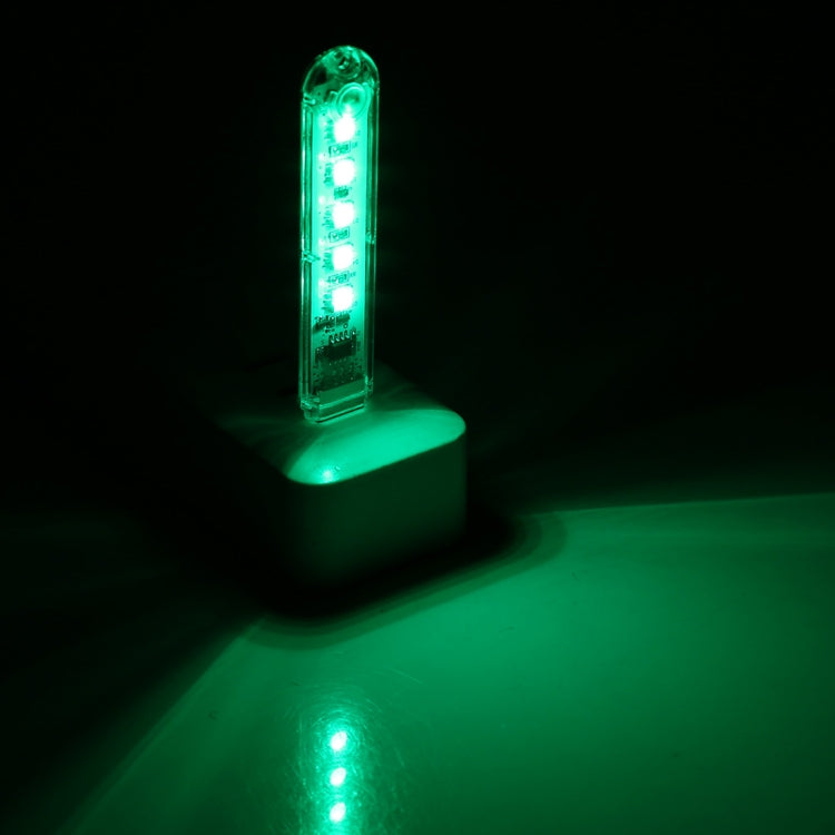 USB LED night light glowing green with 5 LEDs through clear casing