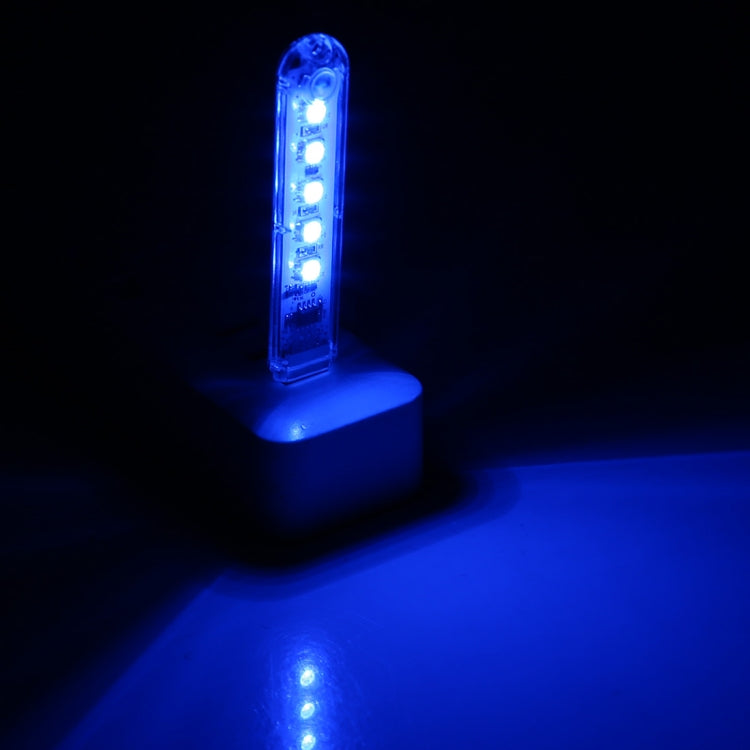 USB LED night light glowing blue with 5 LEDs visible through clear casing