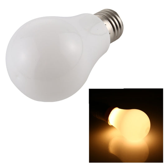 Warm white LED light bulb with E27 screw base, frosted bulb glowing
