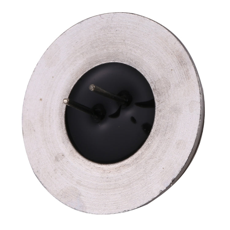 Warm white COB LED G4 light, underside view with black lens and two metal pins