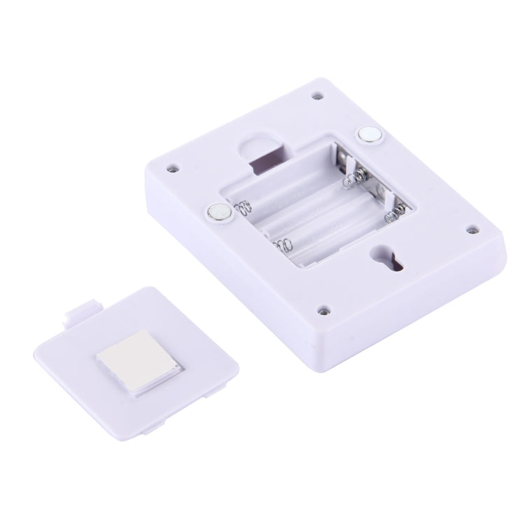 White LED night light battery compartment and mounting base with visible contacts