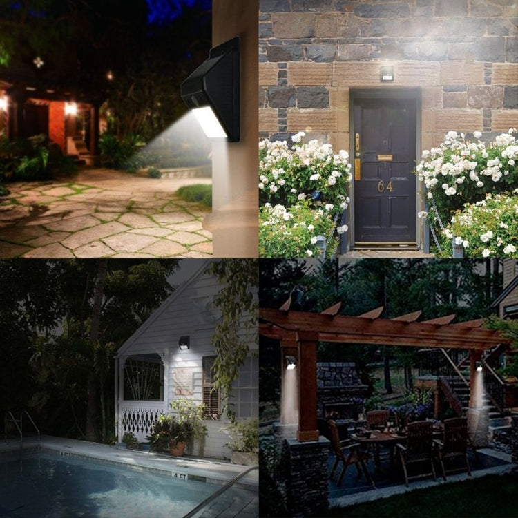 Solar motion sensor wall lights along house walkway at night