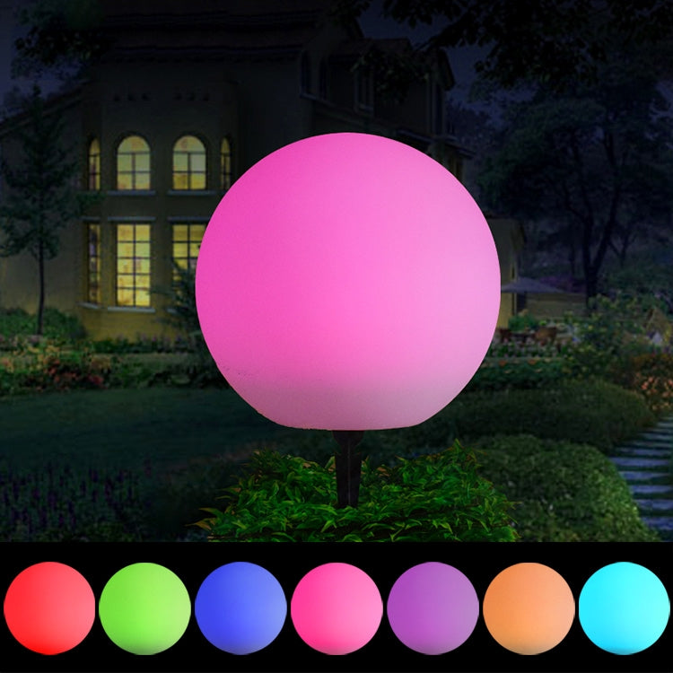 30cm color-changing LED globe light with pink glow on ground stake