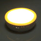 Glowing round LED cabinet emergency light with yellow rim, bright warm white light