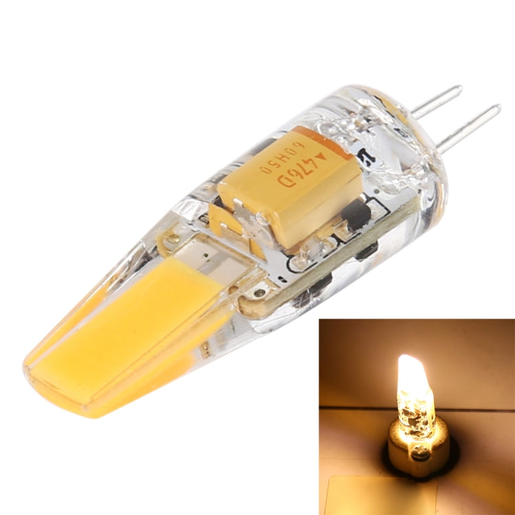 Clear warm-white G4 COB LED corn bulb with two pins, glowing LED strip